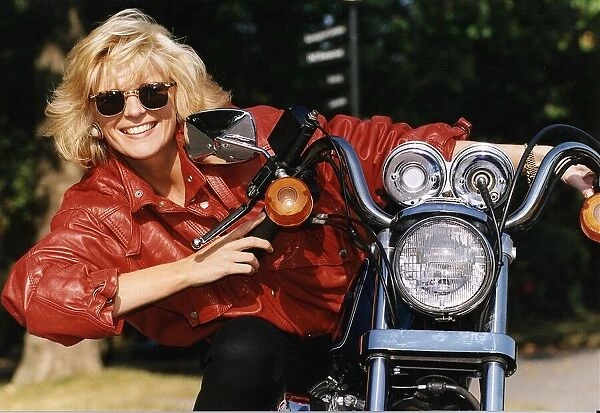 Allison Holloway TV Presenter. Pictured sitting on her Harley Davidson Motorbike