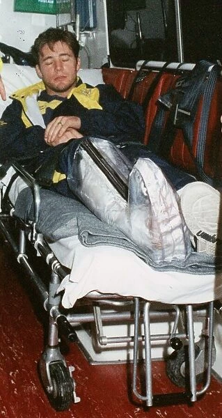 Ally McCoist with broken leg arriving at Edinburgh Airport 1994