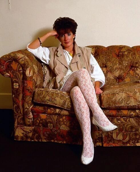 Amanda Kirby sitting on couch November 1984