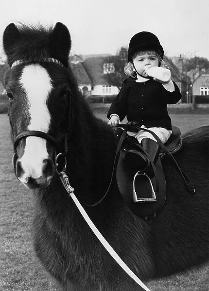 Animals - Children with Horses. Little Charlotte takes a 'stirrup cup'