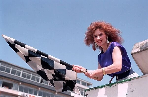 ANITA DOBSON WITH THE CHEQUERED FLAG AT THE MOTOR RACING 26  /  05  /  1992