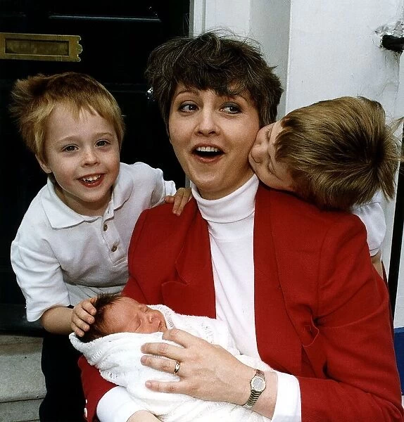 Anne Diamond TV Presenter with children Oliver and Jamie and their baby brother