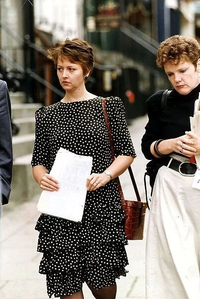 Anne Diamond TV Presenter walking holding some papers