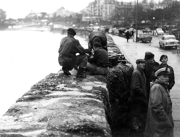 Army gunners attempt to sink a Dutch barge before it damages Torquay harbour in December
