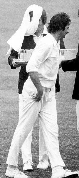 The Ashes 1975. Australian fast bowler Dennis Lillee throws a towel over the head of