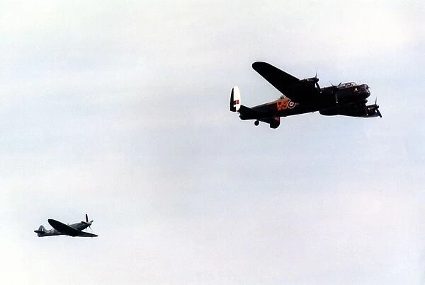 An Avro Lancaster bomber and Supermarine Spitfire fighter aircraft of the Battle of