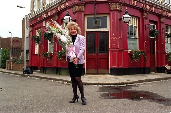 Barbara Windsor Actress March 98 Holding a bunch of flowers on the Easenders set