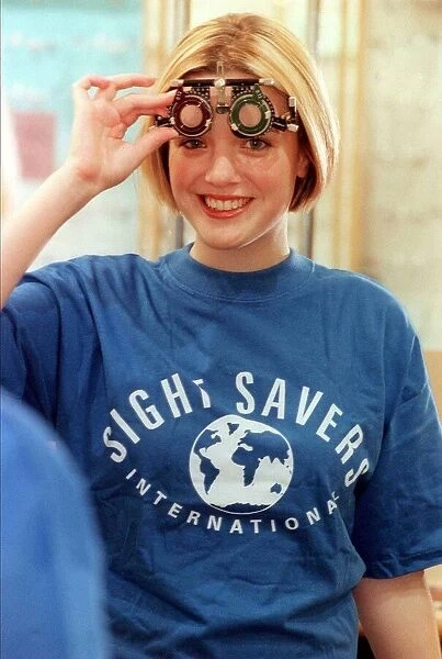 BBC TV Presenter Kate Heavner October 1999 About to test her eye sight at Boots