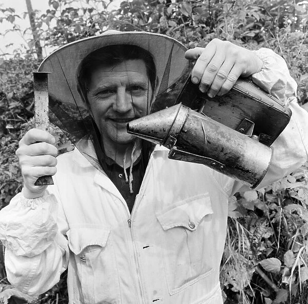 Beekeeper, G Baitey, holding Smoker with heat shield and hook, Newcastle, 22nd July 1971
