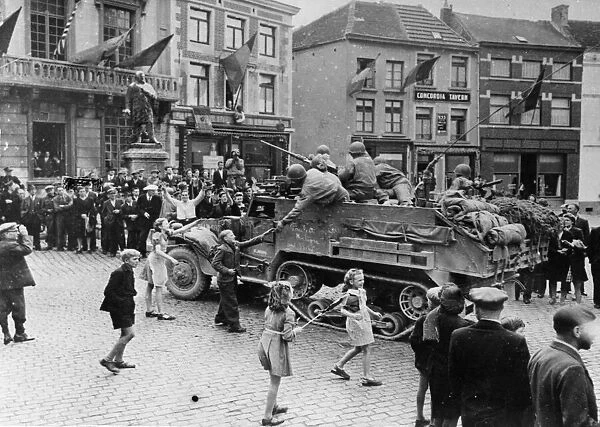 Belgian people go wild with excitement as the first American troops roll in to Soignies