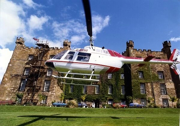 A Bell Jet Ranger helicopter lands at Lumley Castle, Chester-le Street