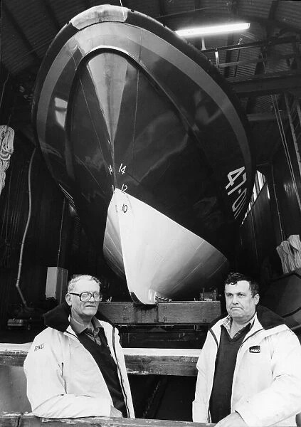 Bertie Roach and Mike Eynon at Angle lifeboat station after receiving their long-service