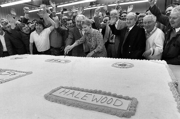 Billy Hughes cuts into the monster birthday cake to celebrate Fords 25th birthday at