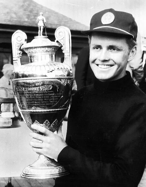 Bobby Cole South African Golfer holding the British Amateur Golf Trophy in 1966