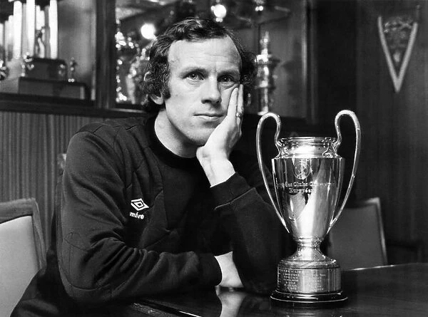 Bobby as he sits and ponders, with a replica of that famous trophy. October 1979 P009692