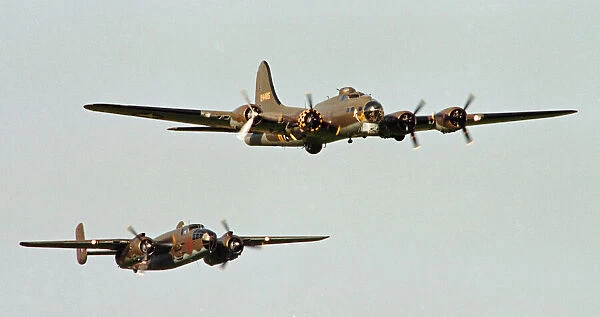 A Boeing B17 Flying Fortress (The Sally B) seen here flying in formation with a North