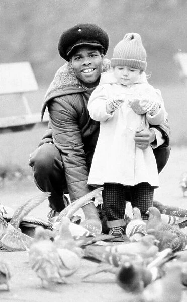 Boxer Kirkland Laing seen here with his child. 2nd December 1987