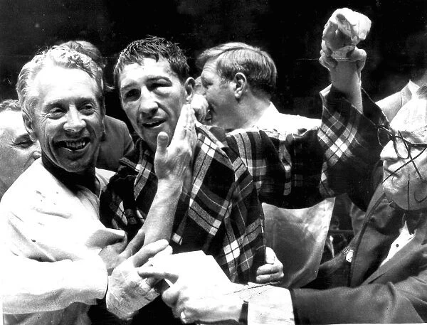 boxing 1970 LIGHTWEIGHT CHAMPION KEN BUCHANAN OF SCOTLAND GETS A PAT ON THE CHEEK FROM
