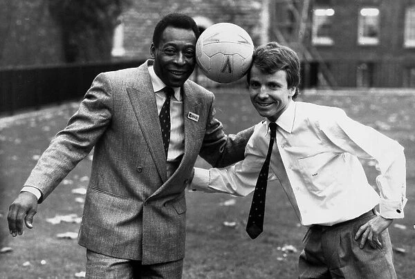 Former Brazilian football star Pele poses with Sports Minister Colin Moynihan MP while