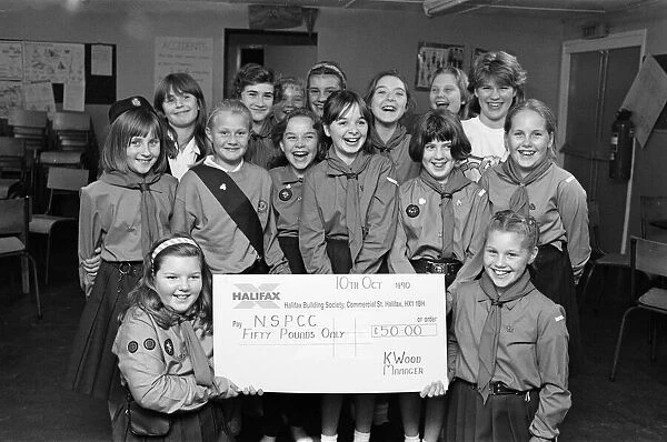 Breaking their silence to present 50 to the NSPCC were these Girl Guides