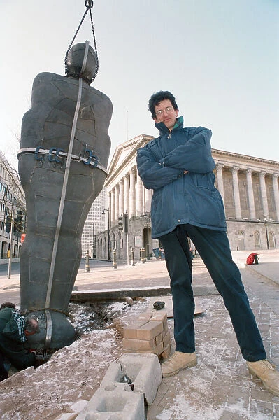 British sculptor Antony Gormley stands beside his latest work