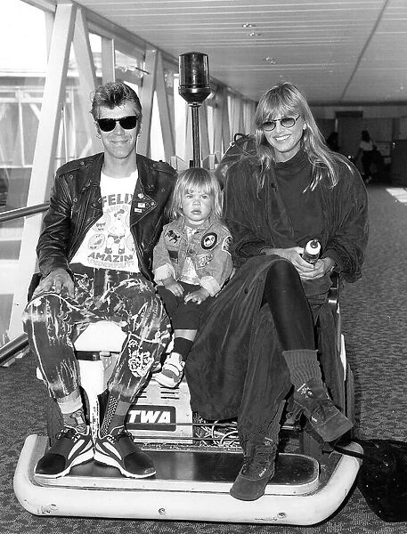 Britt Ekland actress and her husband Jim McDonnell with her son Thomas arriving at