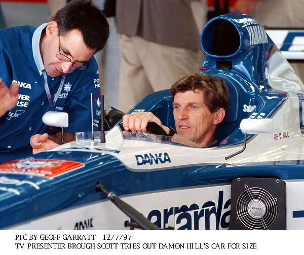 Brough Scott TV Presenter in Damons Hills racing Car July 1997 at Silverstone racetrack