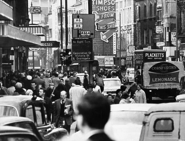 Busy scenes in Market Street, central manchester. 14th January 1969
