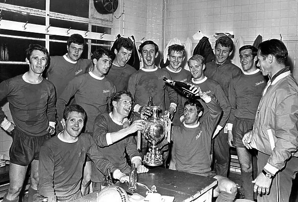 Cardiff City players celebrate with champagne after they had won the Welsh Cup at Ninian