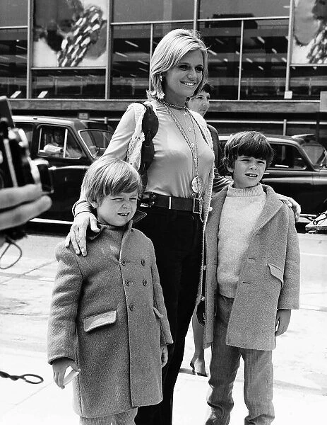 Carol White arrining at Heathrow airport with her sons May 1970 Dbase MSI