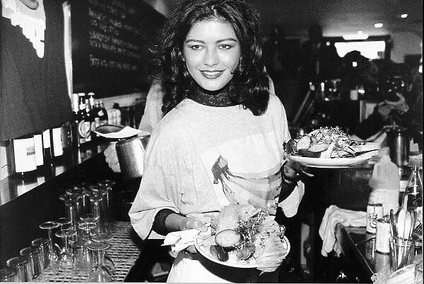 Catherine Zeta Jones Actress plays a waitress at the Cafe Casbar in aid of a charity