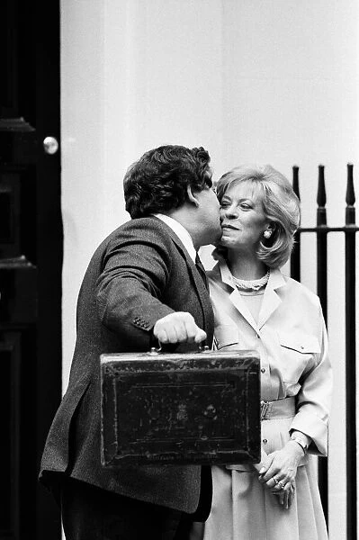 Chancellor of the Exchequer Nigel Lawson outside 11 Downing Street with his wife Therese