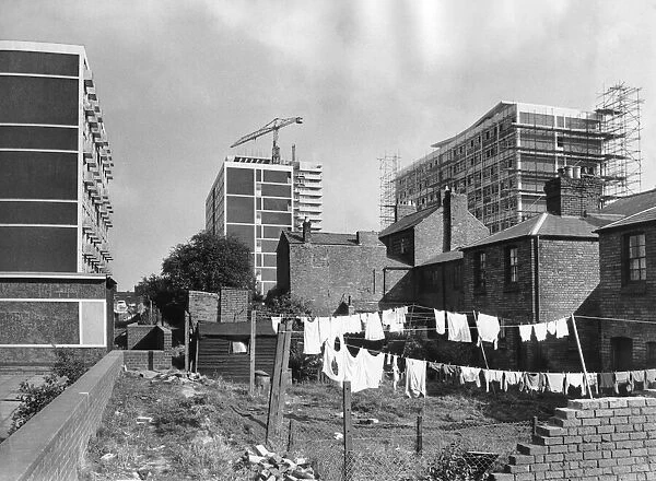 The changing face of Coventry is shown by these new blocks of flats towering over old