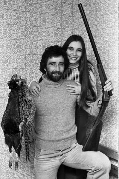 Prints of Charlton Athletic footballer Derek Hales poses with his wife  Carol while holding his