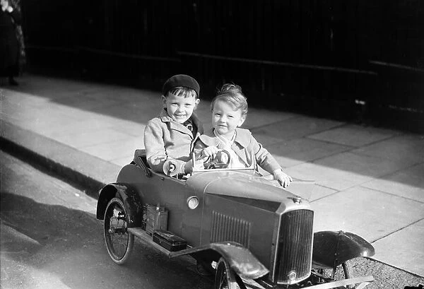 The Cheeseman boys seen here playing with their new pedal car in Malden September 1936