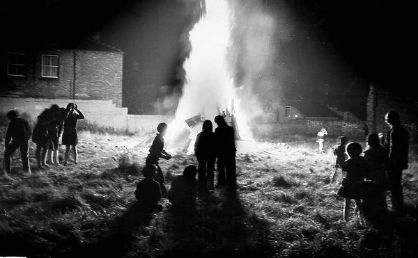 Children gather around a bonfire in Everton. 5th November 1975