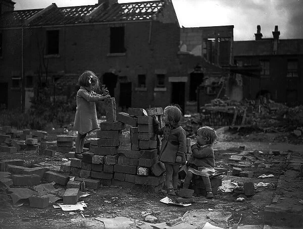 Children playing on bomb site after a bombing raid in London during WW2