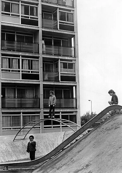 Children playing on play equipment on land between flats at Hillfields, Coventry