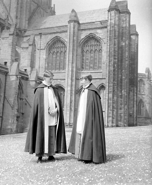 Two choristers stand in the grounds of Lichfield Cathedral. September 1959