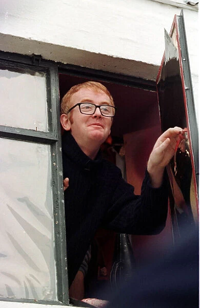Chris Evans Radio TV Presenter looking out of open window November 1997