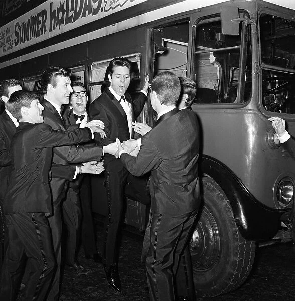 Cliff Richard and some of the Shadows with a hired London Transport bus