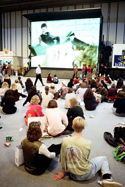 Clothes Show Live, audience members looking at a big screen, Birmingham NEC