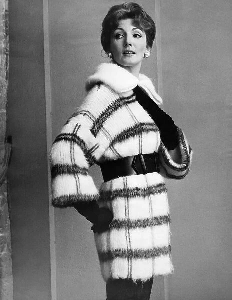 Clothing Fashion 1959: Joan Fullard a ref haired Australian girl wears a Fleming Reid