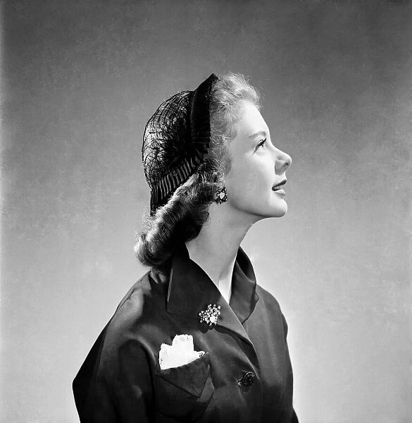Clothing: Fashion: Hats Hat of ribbon of veiling. June 1952 C3241