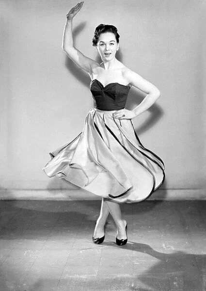 Clothing: Fashion: Skirt: Woman wearing leaf skirt. Model: Jackie Curtis. 1957 B480-001