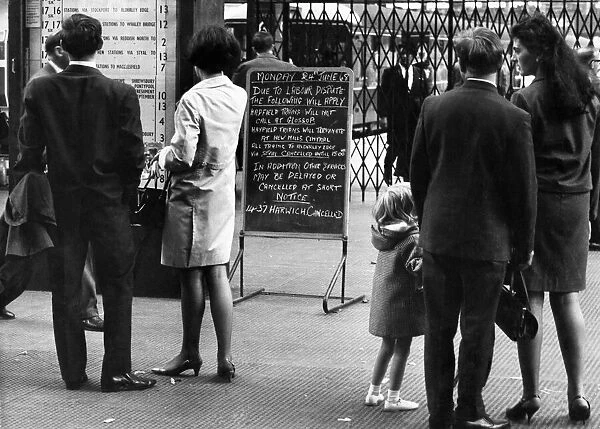 Customers read notice of a strike at a London railways station. June 1968