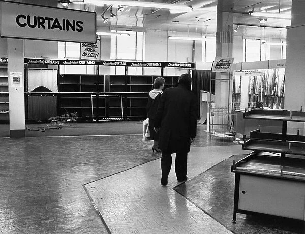 Some of the last customers wander through the empty sales floor as Blackers Department