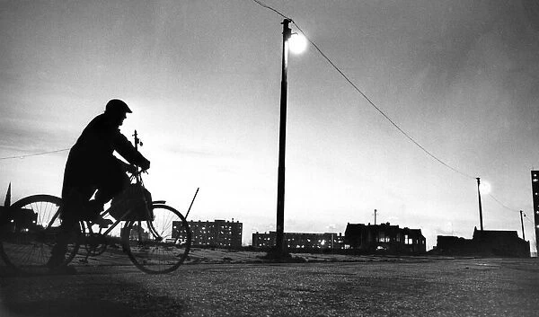 A cyclist taking a break as he rides through wasteland in Everton