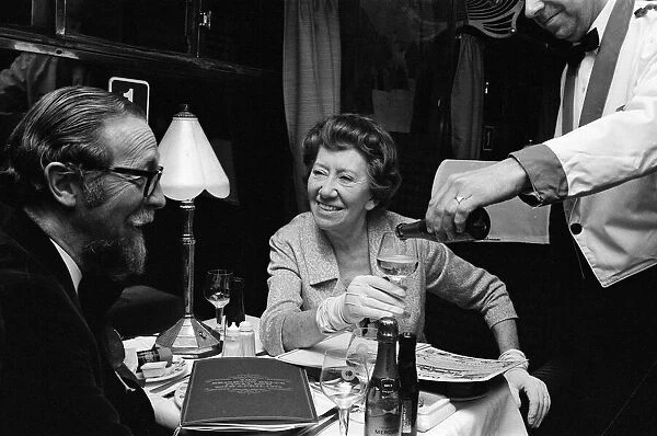Dame Flora Robson March 1972 drink a toast to old times as the Brighton Belle train