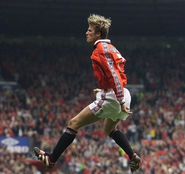 David Beckham celebrating after scoring May 1999 for Manchester United against